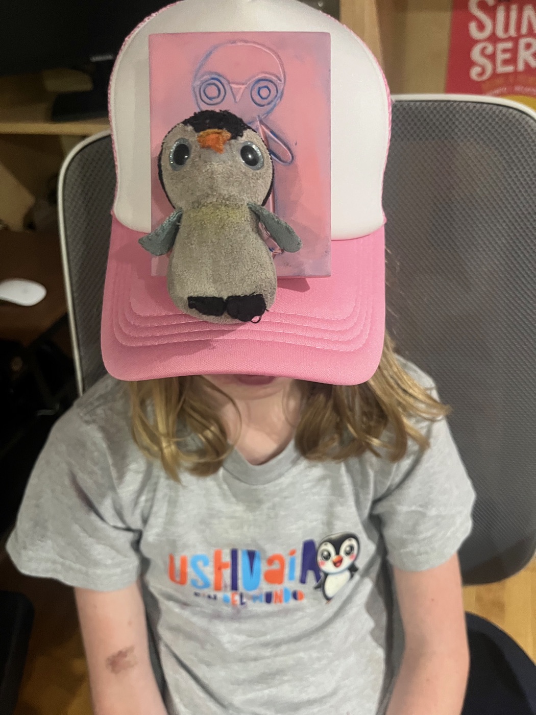 Finished shirts with Pengi the stuffed penguin