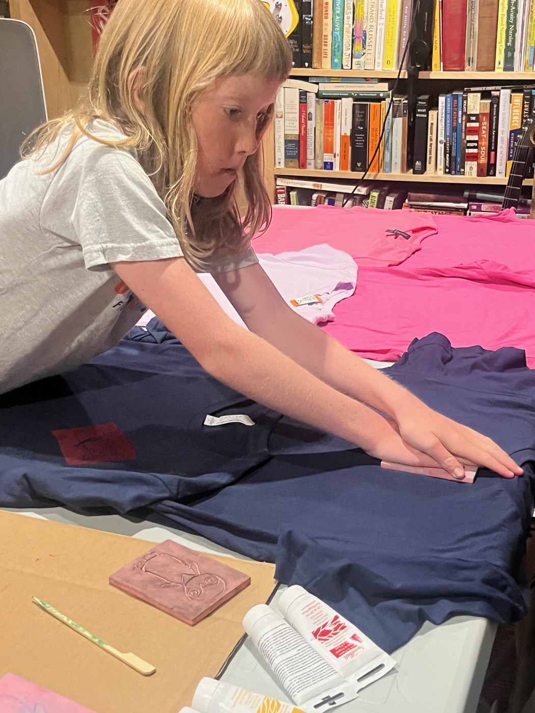 Beatrix pressing the block onto a navy shirt