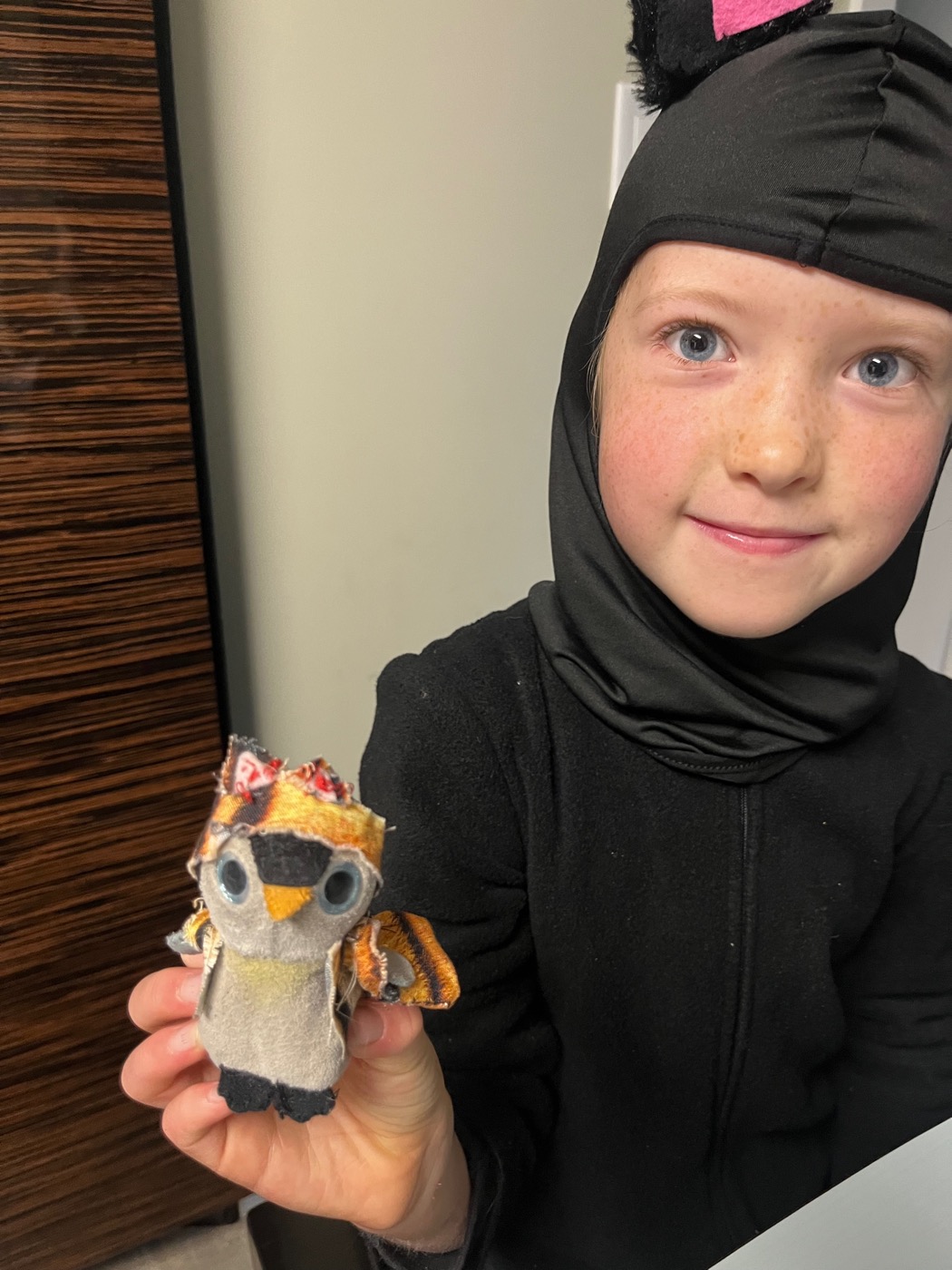 Beatrix holding Pengi in a homemade tiger costume